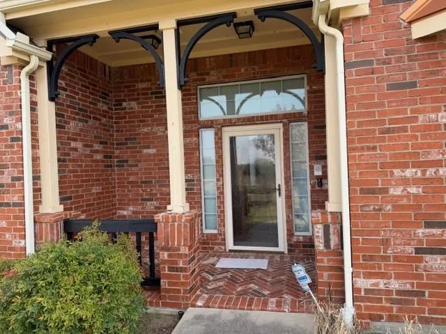 a front view of a house with a glass door