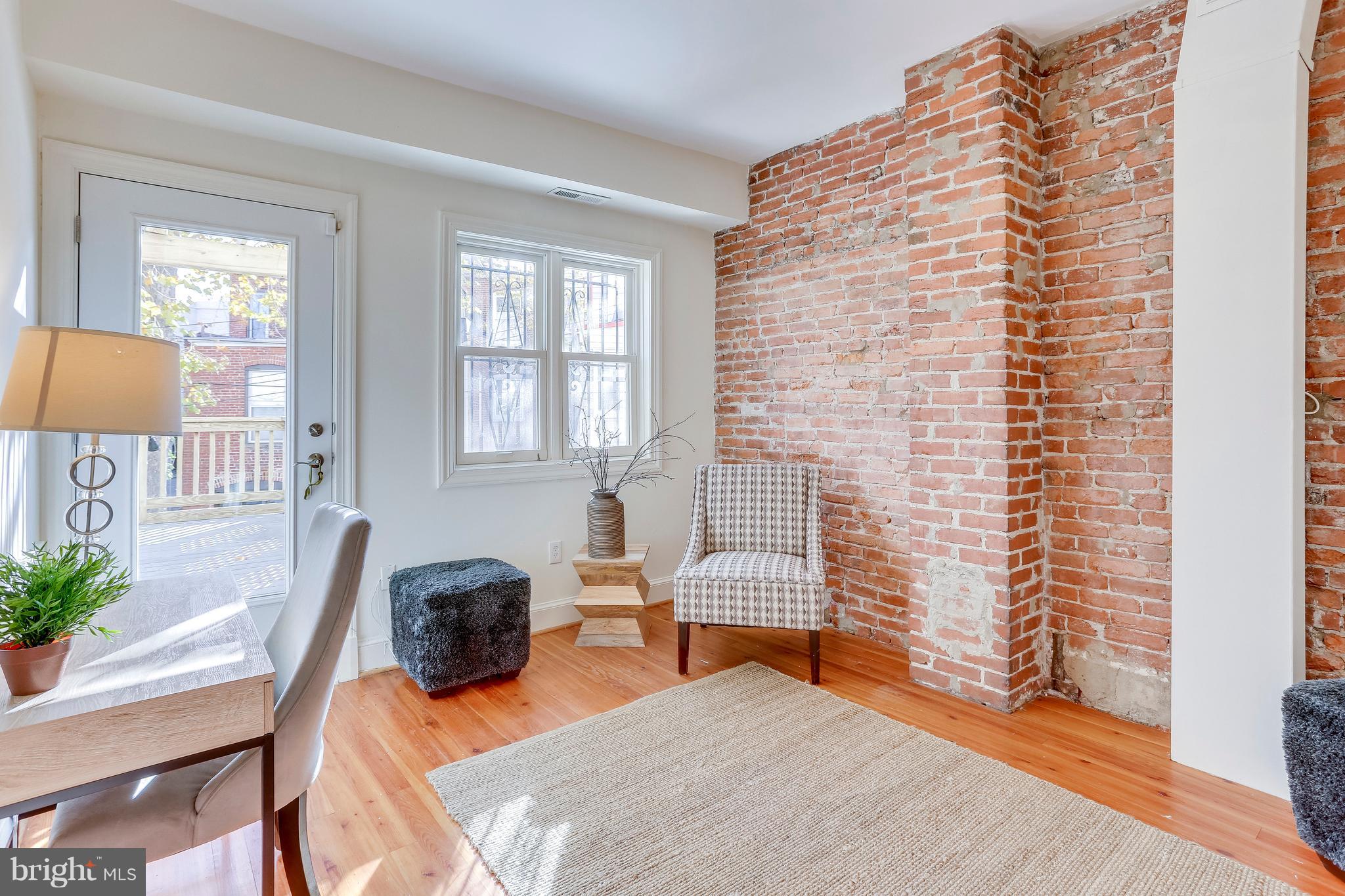 123 Tennessee Avenue Northeast Washington, DC 20002 - Photo 13 of 27 a bedroom with furniture and a window