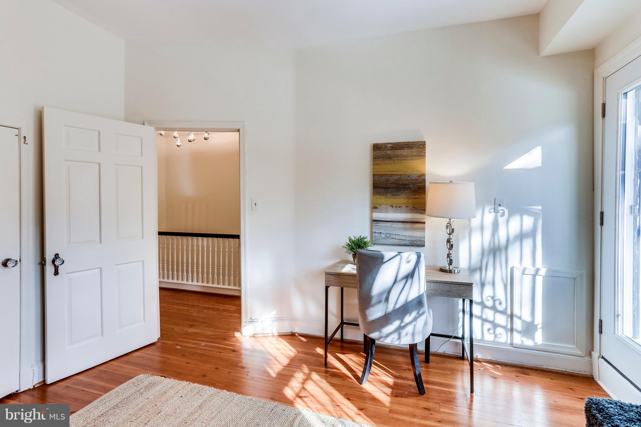 123 Tennessee Avenue Northeast Washington, DC 20002 - Photo 14 of 27 a view of a livingroom with furniture and wooden floor