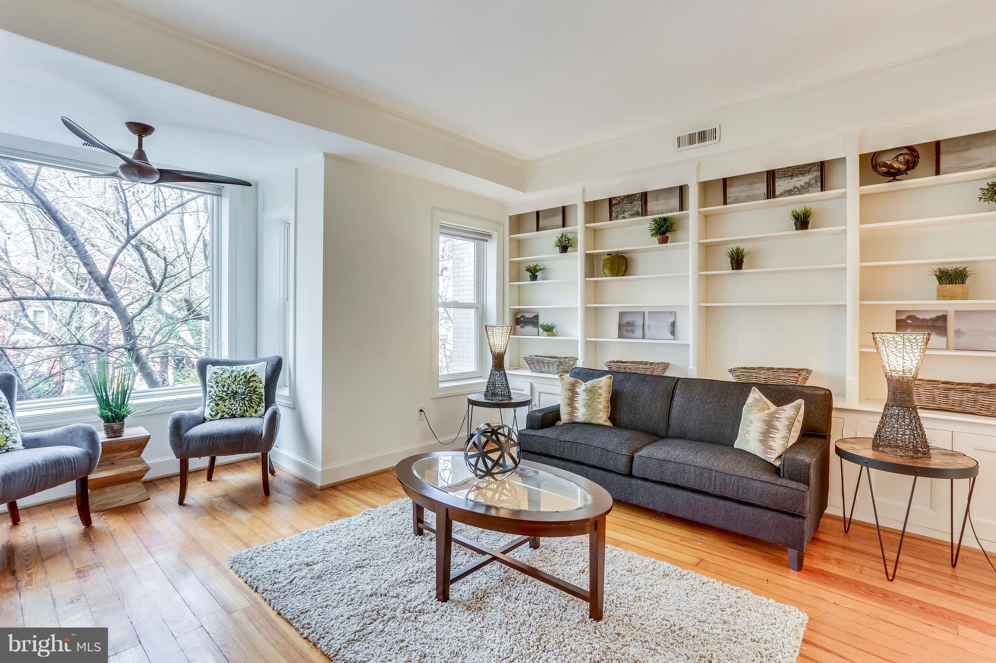 123 Tennessee Avenue Northeast Washington, DC 20002 - Photo 17 of 27 a living room with furniture and a rug