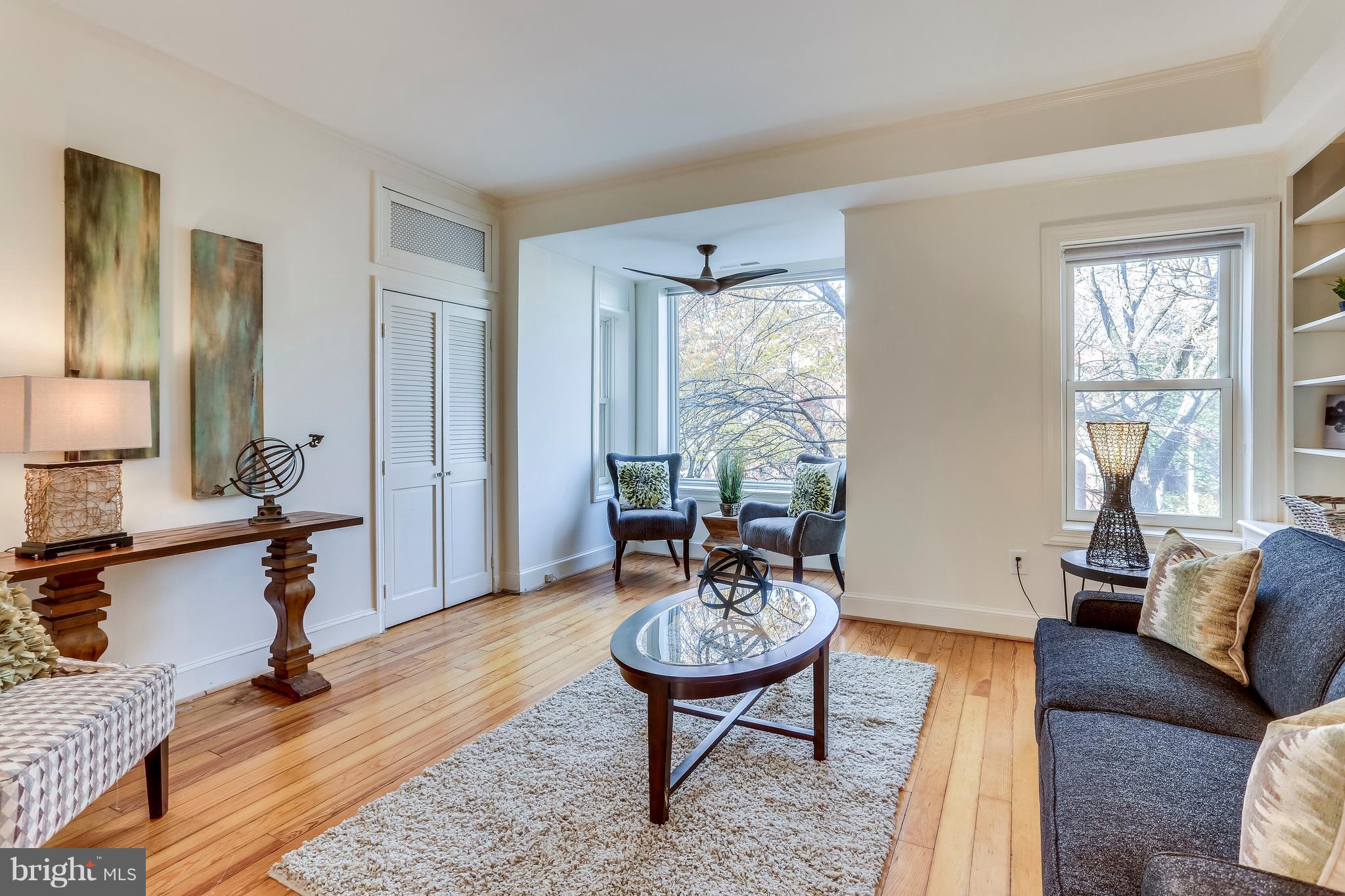 123 Tennessee Avenue Northeast Washington, DC 20002 - Photo 18 of 27 a living room with furniture and a wooden floor
