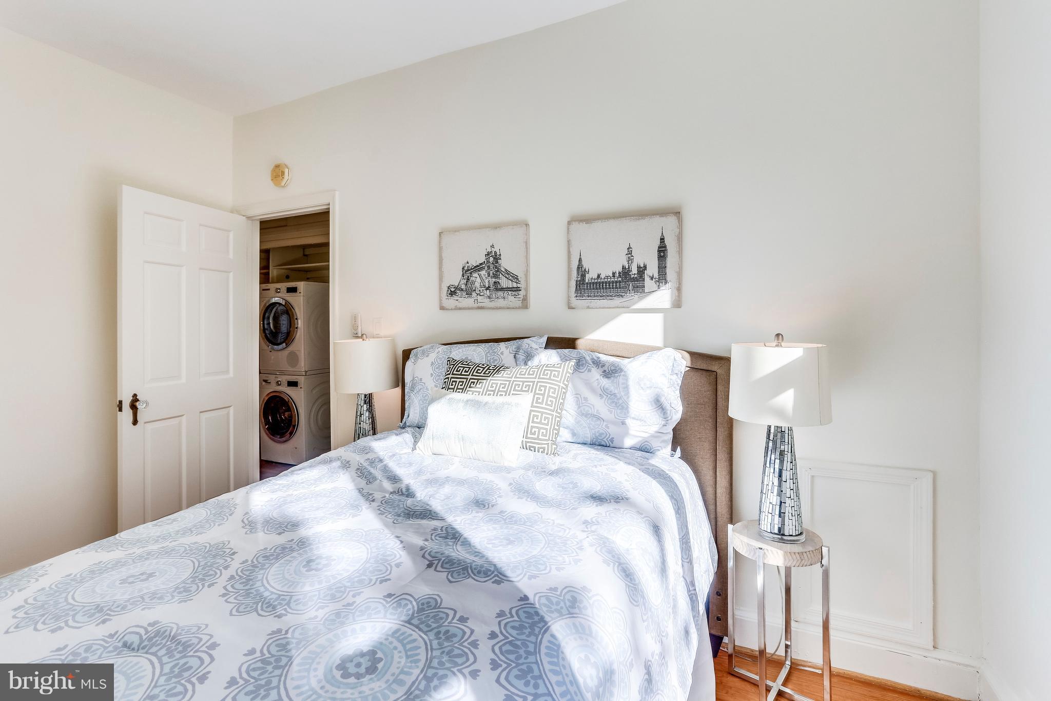 123 Tennessee Avenue Northeast Washington, DC 20002 - Photo 20 of 27 a bed room with a bed and a night stand