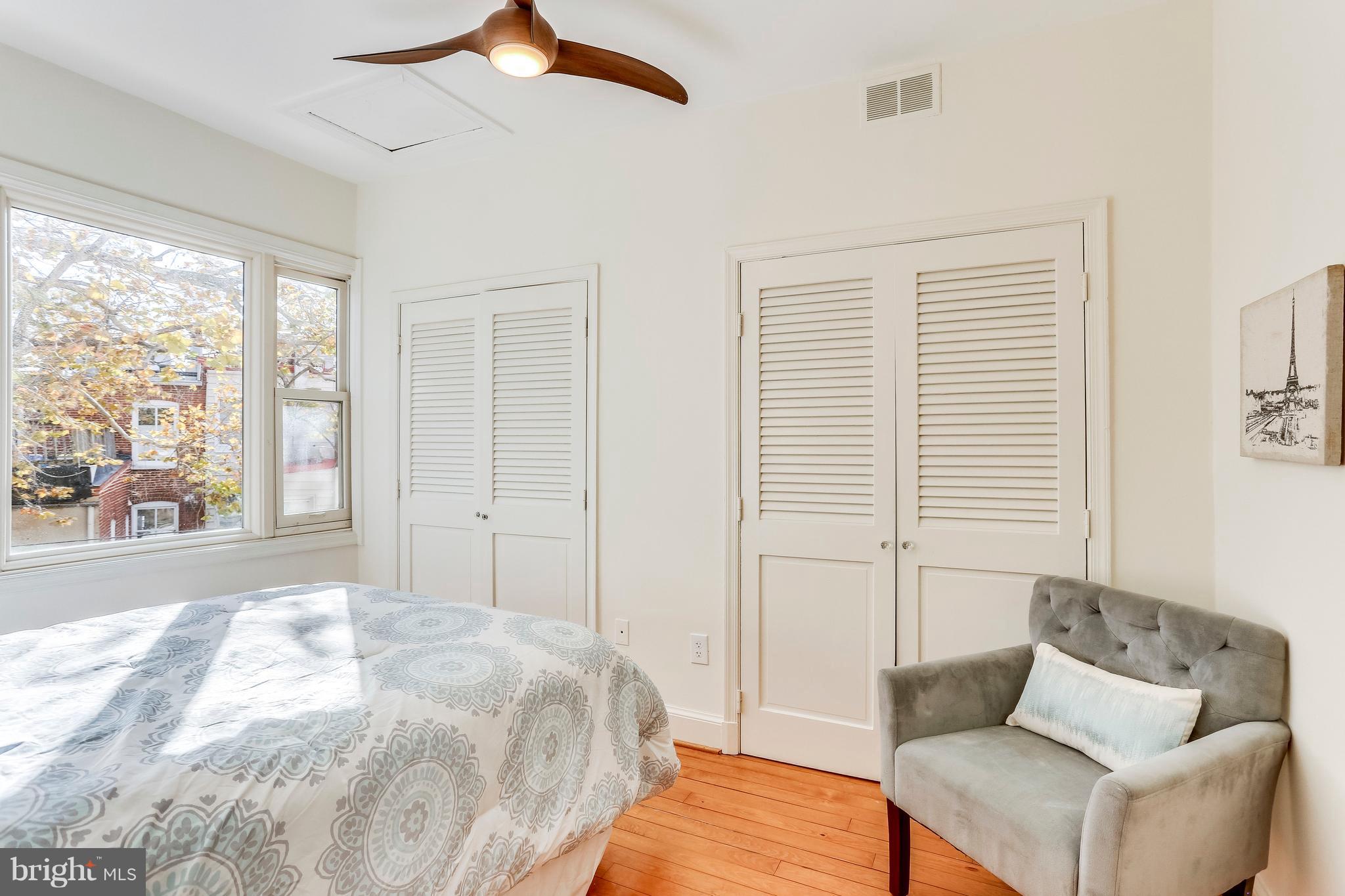 123 Tennessee Avenue Northeast Washington, DC 20002 - Photo 21 of 27 a bedroom with a bed and a couch