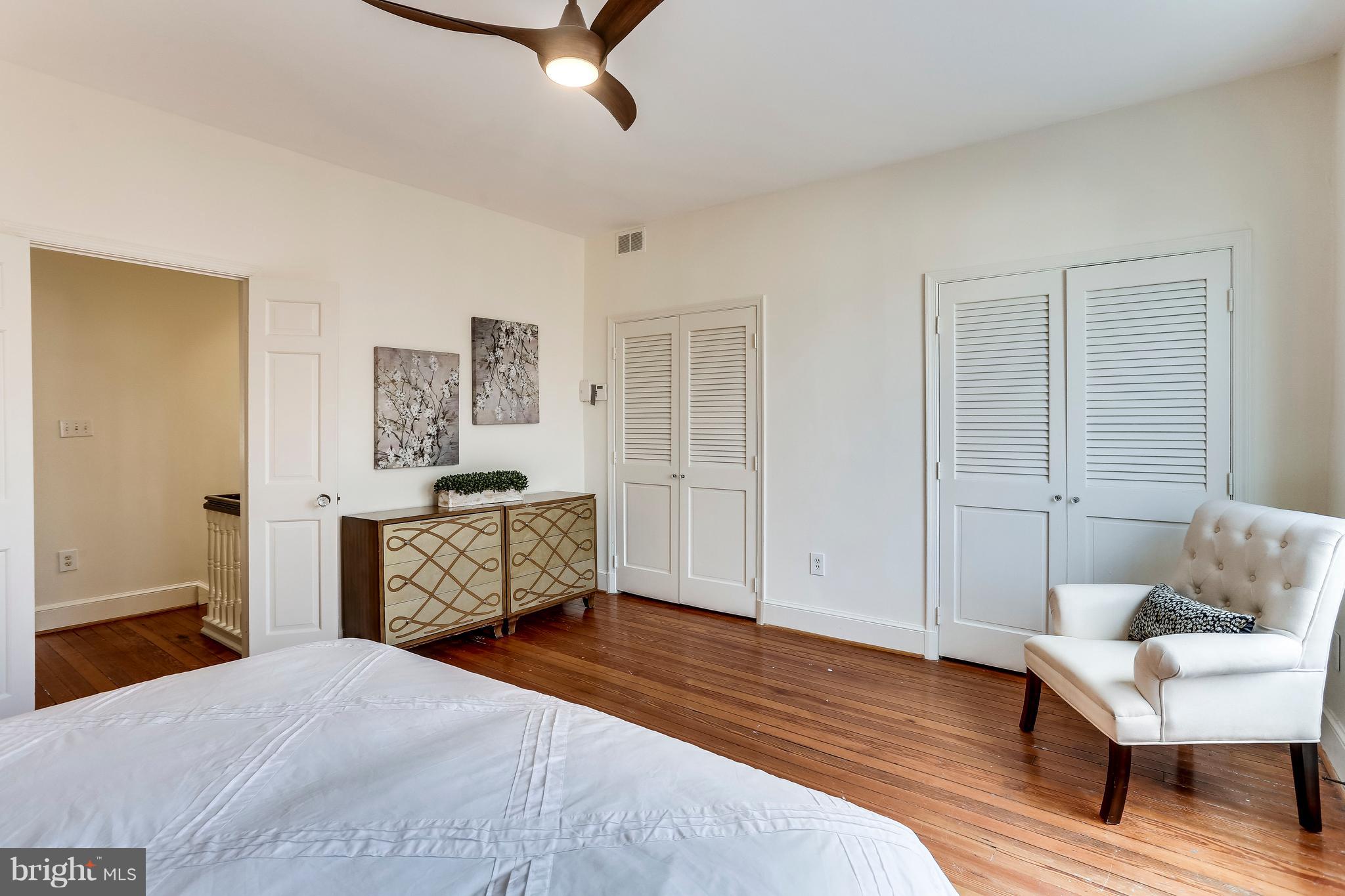 123 Tennessee Avenue Northeast Washington, DC 20002 - Photo 26 of 27 a bedroom with a bed and a couch