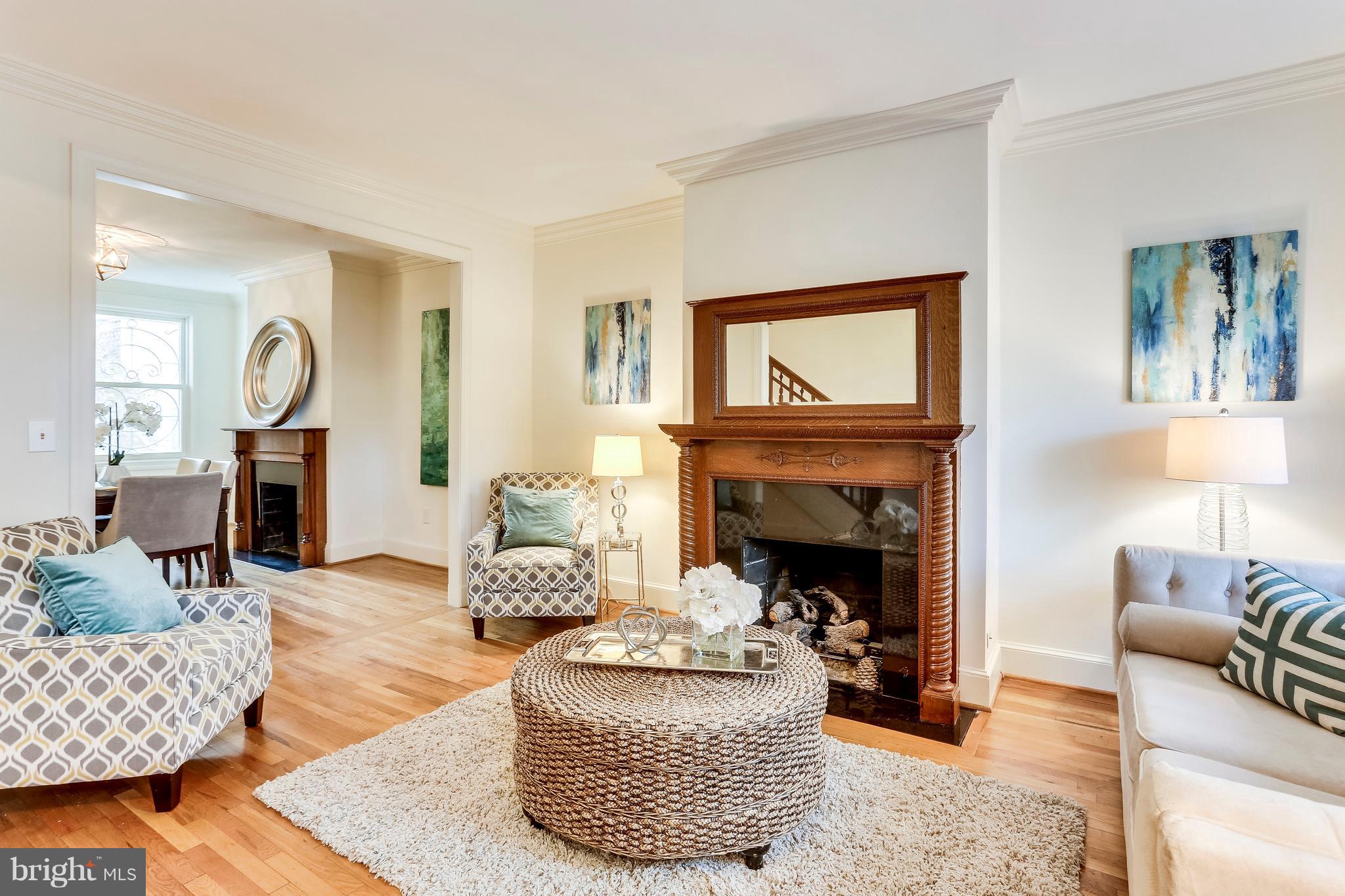123 Tennessee Avenue Northeast Washington, DC 20002 - Photo 4 of 27 a living room with furniture and a fireplace