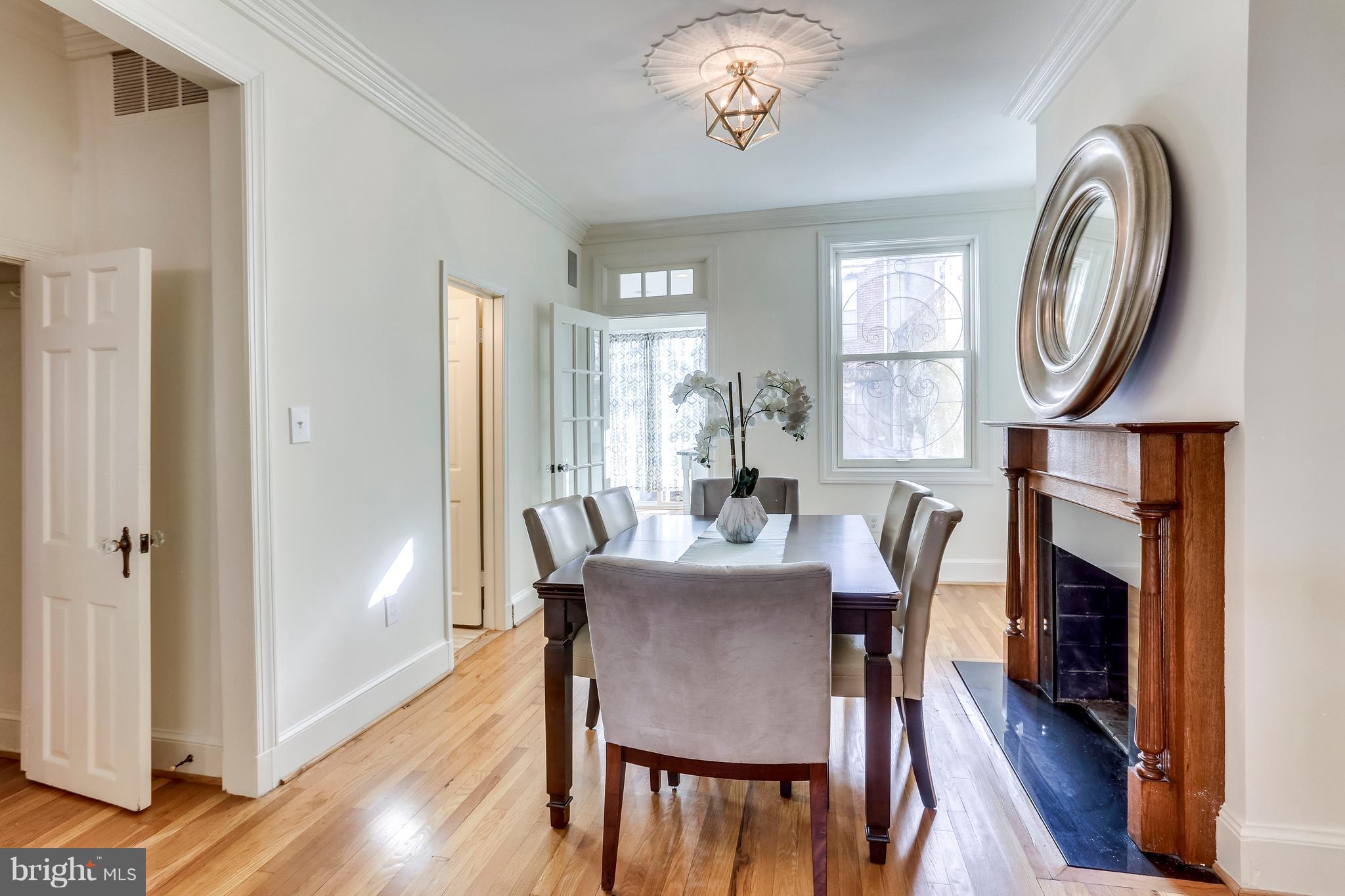 123 Tennessee Avenue Northeast Washington, DC 20002 - Photo 6 of 27 a view of a dining room with furniture window and wooden floor