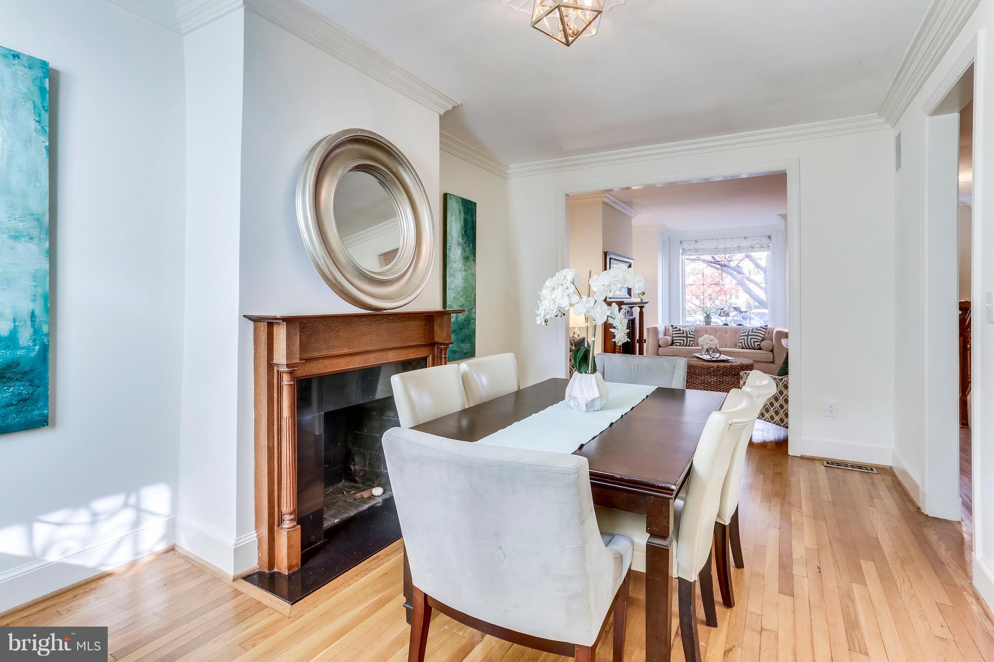 123 Tennessee Avenue Northeast Washington, DC 20002 - Photo 7 of 27 a view of a dining room with furniture and wooden floor