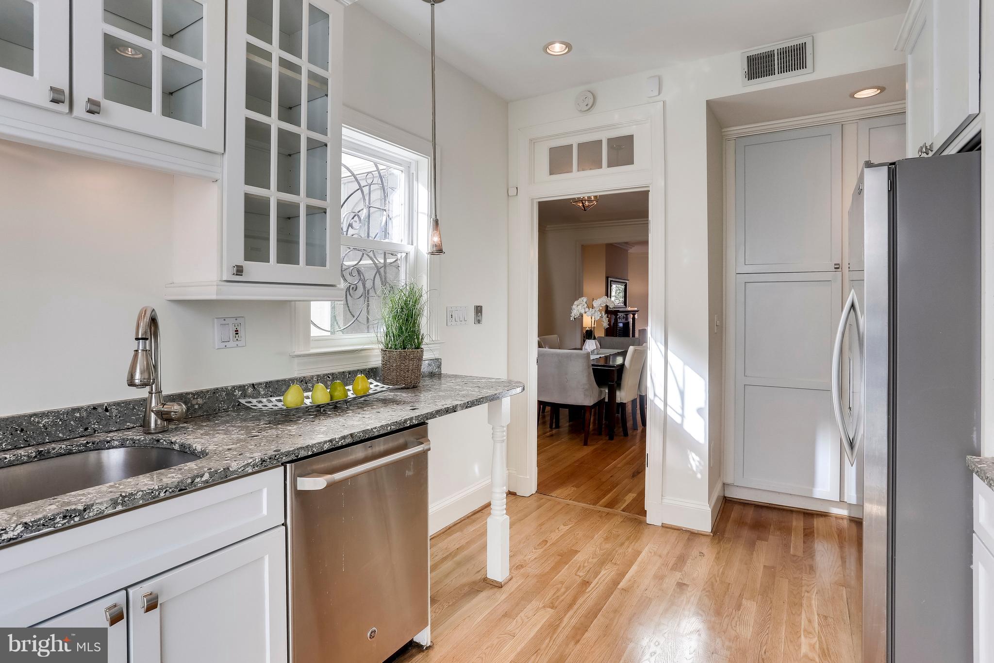 123 Tennessee Avenue Northeast Washington, DC 20002 - Photo 10 of 27 a kitchen with a sink stove and cabinets