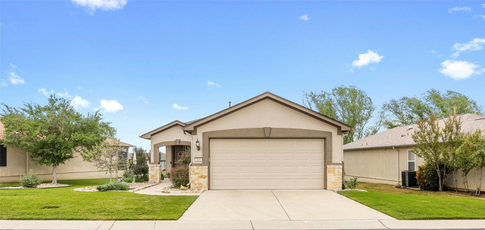 104 Monument Hill Trail Georgetown, TX 78633 - Photo 1 of 30 a front view of a house with a yard and garage