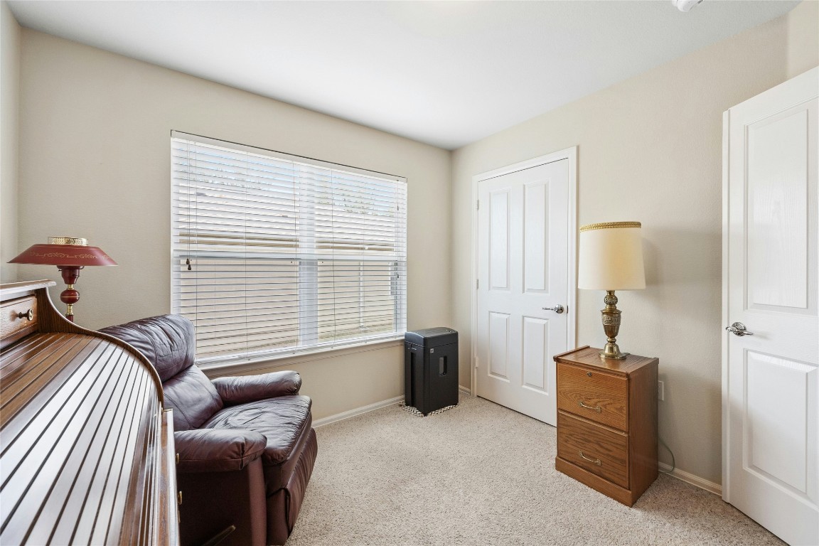 104 Monument Hill Trail Georgetown, TX 78633 - Photo 21 of 30 a bedroom with furniture and a window