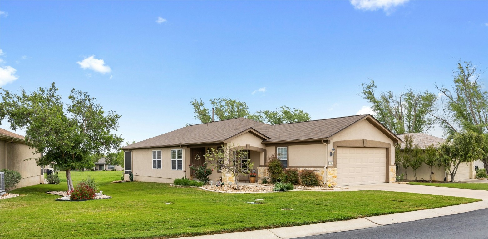 104 Monument Hill Trail Georgetown, TX 78633 - Photo 3 of 30 a front view of a house with a yard and garage
