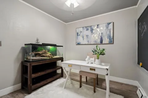 a dining room with furniture and window