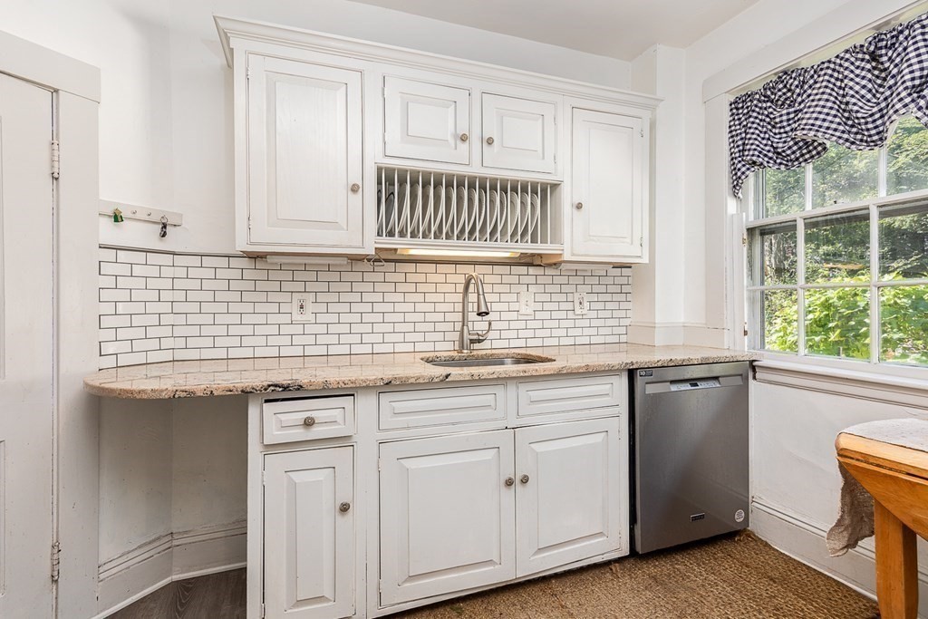 2 Orne Square, Unit 2 Salem, MA 01970 - Photo 11 of 28 a kitchen with granite countertop a sink and a window