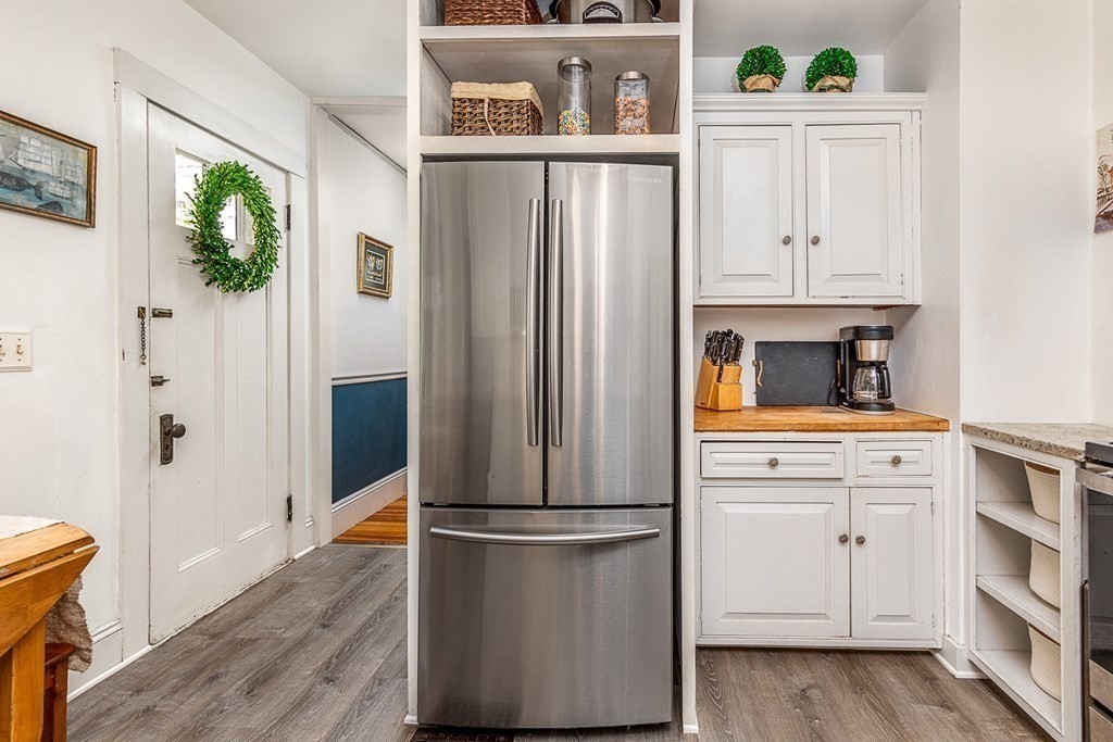 2 Orne Square, Unit 2 Salem, MA 01970 - Photo 13 of 28 a kitchen with white cabinets and refrigerator