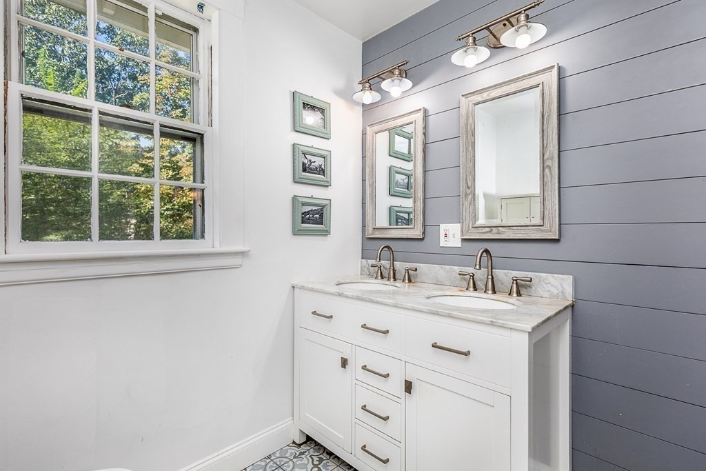 2 Orne Square, Unit 2 Salem, MA 01970 - Photo 21 of 28 a bathroom with a sink and a mirror