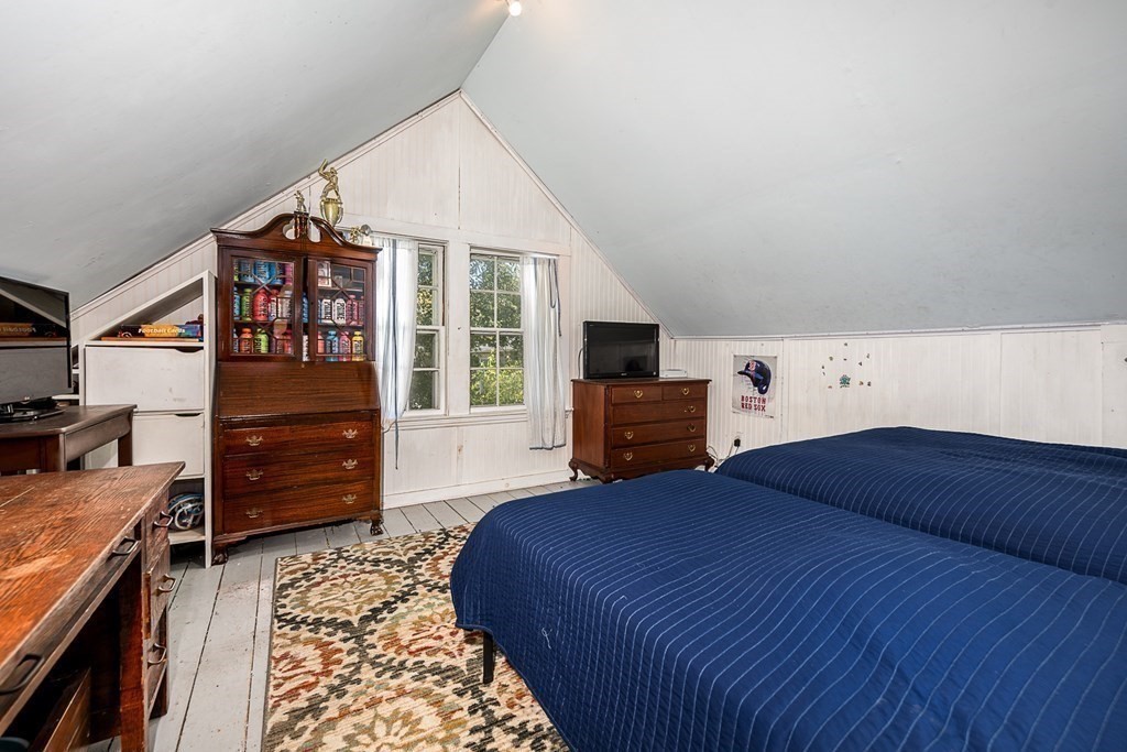2 Orne Square, Unit 2 Salem, MA 01970 - Photo 24 of 28 a bedroom with a bed and a television
