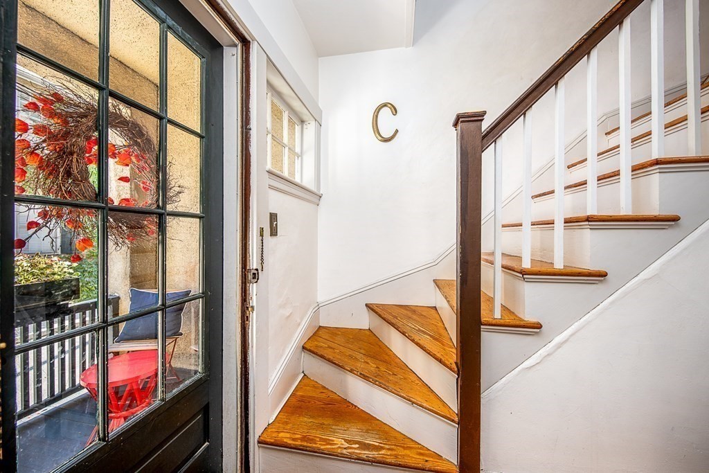 2 Orne Square, Unit 2 Salem, MA 01970 - Photo 5 of 28 staircase with two large window and furniture