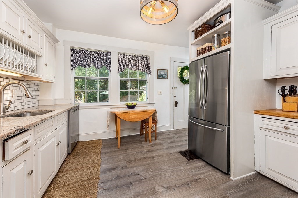 2 Orne Square, Unit 2 Salem, MA 01970 - Photo 10 of 28 a kitchen with stainless steel appliances granite countertop a refrigerator and a sink