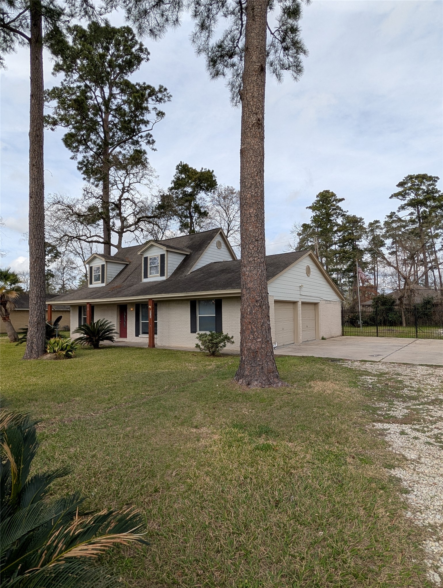 515 Broad Ripple Drive Houston, TX 77336 - Photo 18 of 21 a front view of a house with a garden and tree