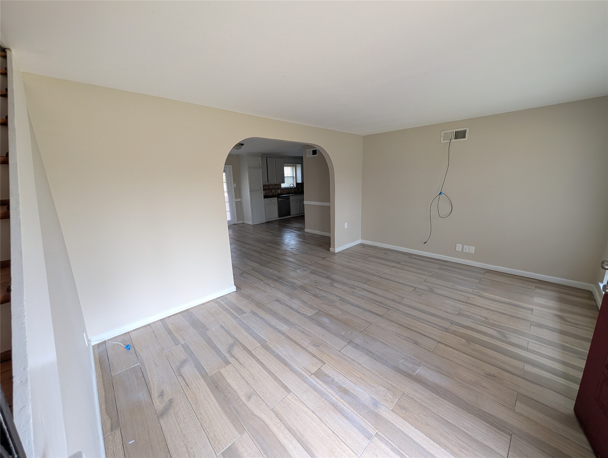 515 Broad Ripple Drive Houston, TX 77336 - Photo 3 of 21 a view of a room with wooden floor and a window