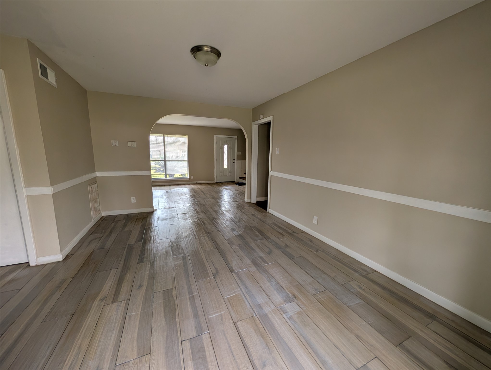 515 Broad Ripple Drive Houston, TX 77336 - Photo 4 of 21 a view of a room with wooden floors and window
