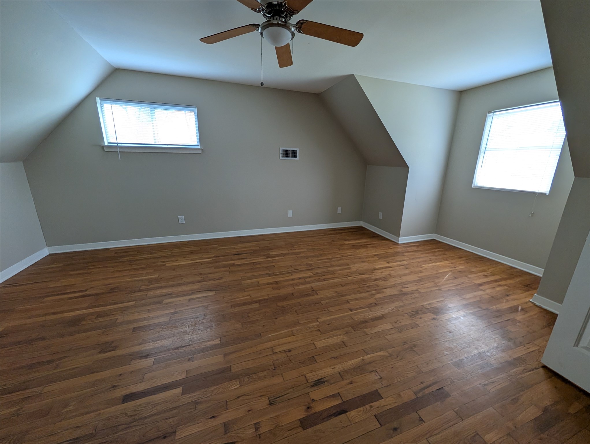 515 Broad Ripple Drive Houston, TX 77336 - Photo 10 of 21 an empty room with wooden floor fan and windows