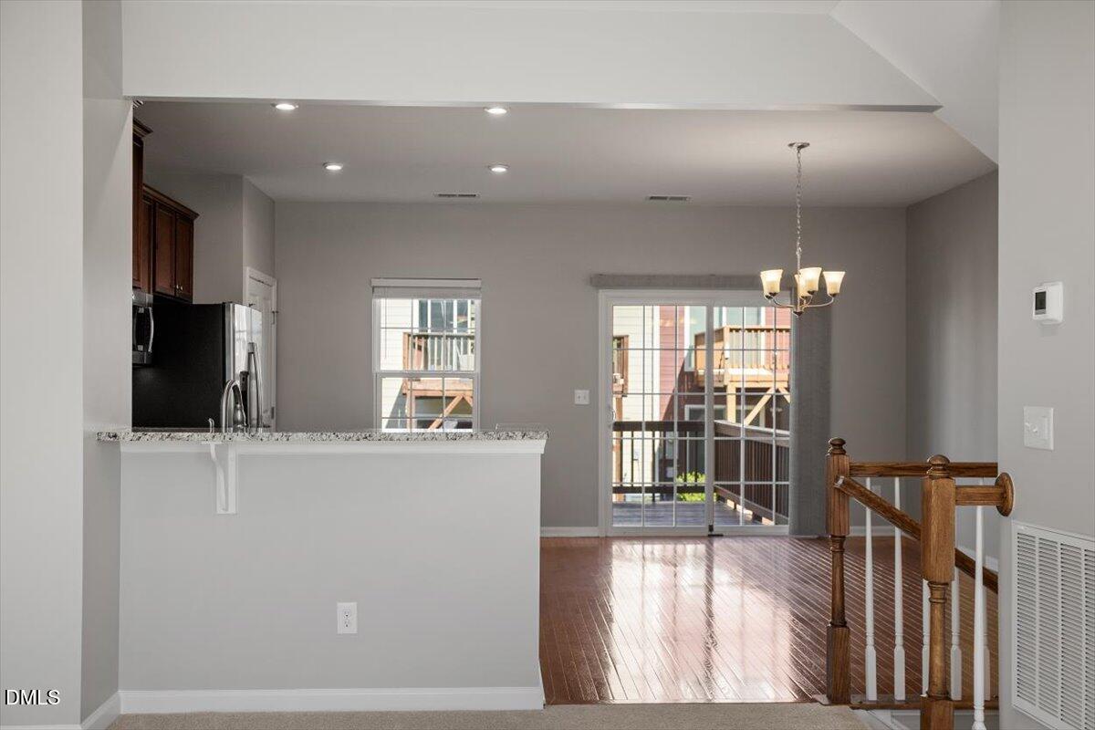 117 Brier Ridge Drive Durham, NC 27703 - Photo 10 of 29 a living room with furniture and a flat screen tv