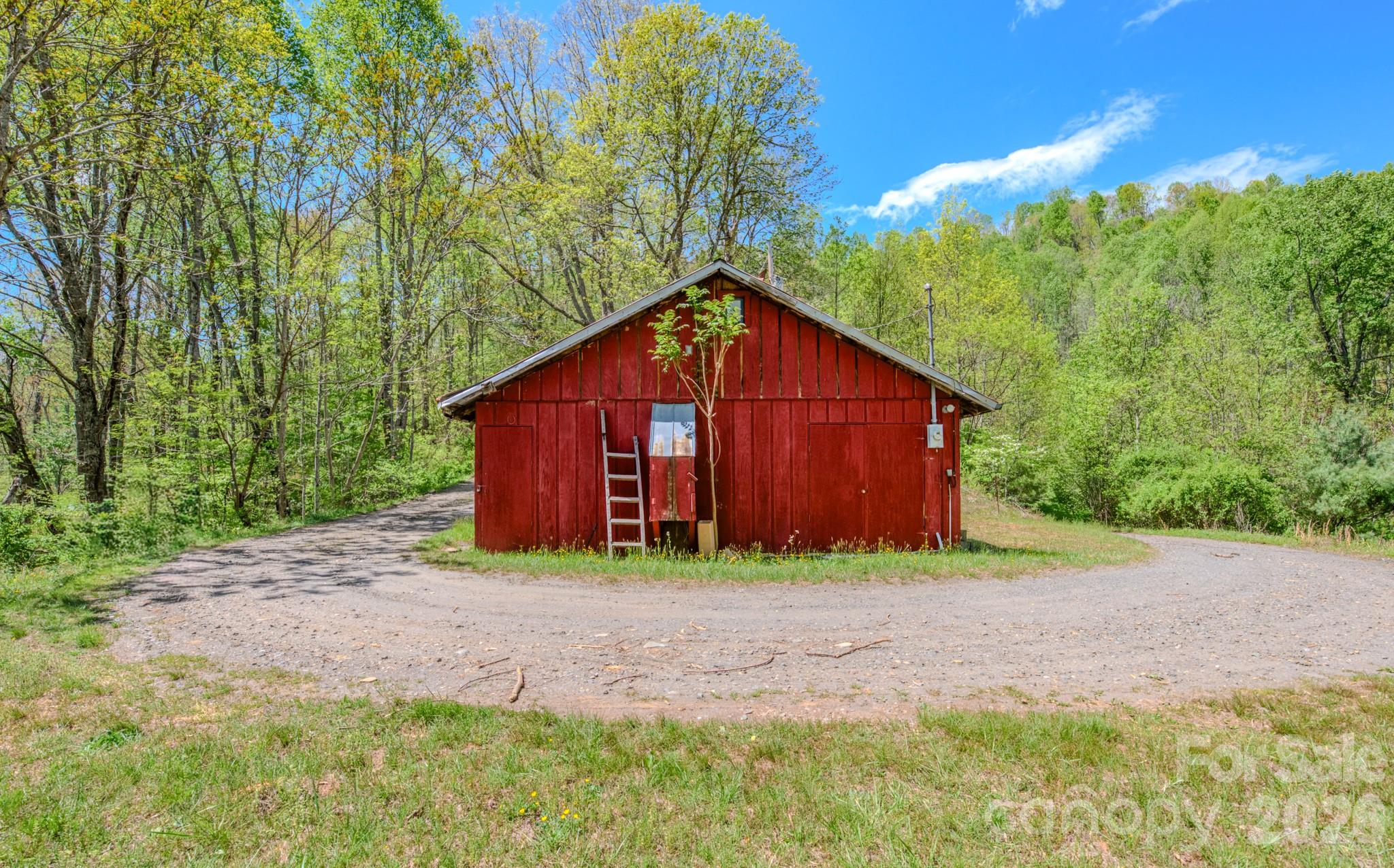 143 Gouge Cemetery Road Bakersville, NC 28705 - Photo 2 of 47 a view of backyard of house with green space