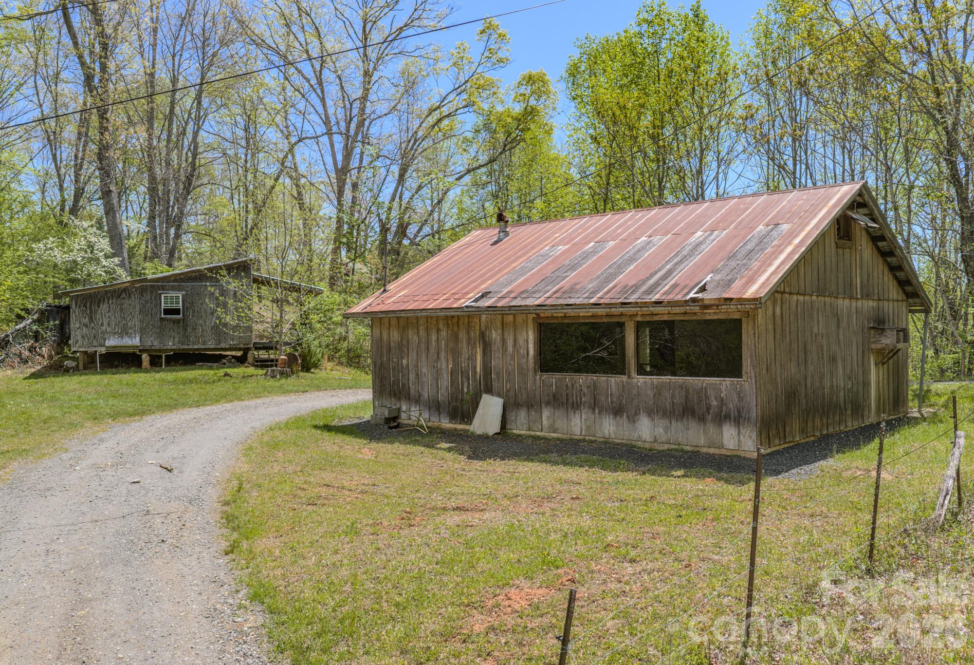 143 Gouge Cemetery Road Bakersville, NC 28705 - Photo 3 of 47 a view of a house with a yard