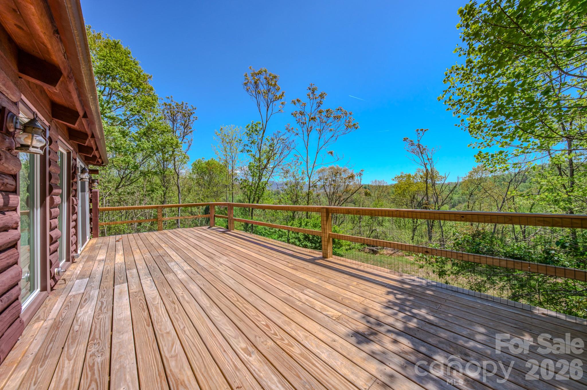 143 Gouge Cemetery Road Bakersville, NC 28705 - Photo 47 of 47 a view of balcony with wooden floor and fence
