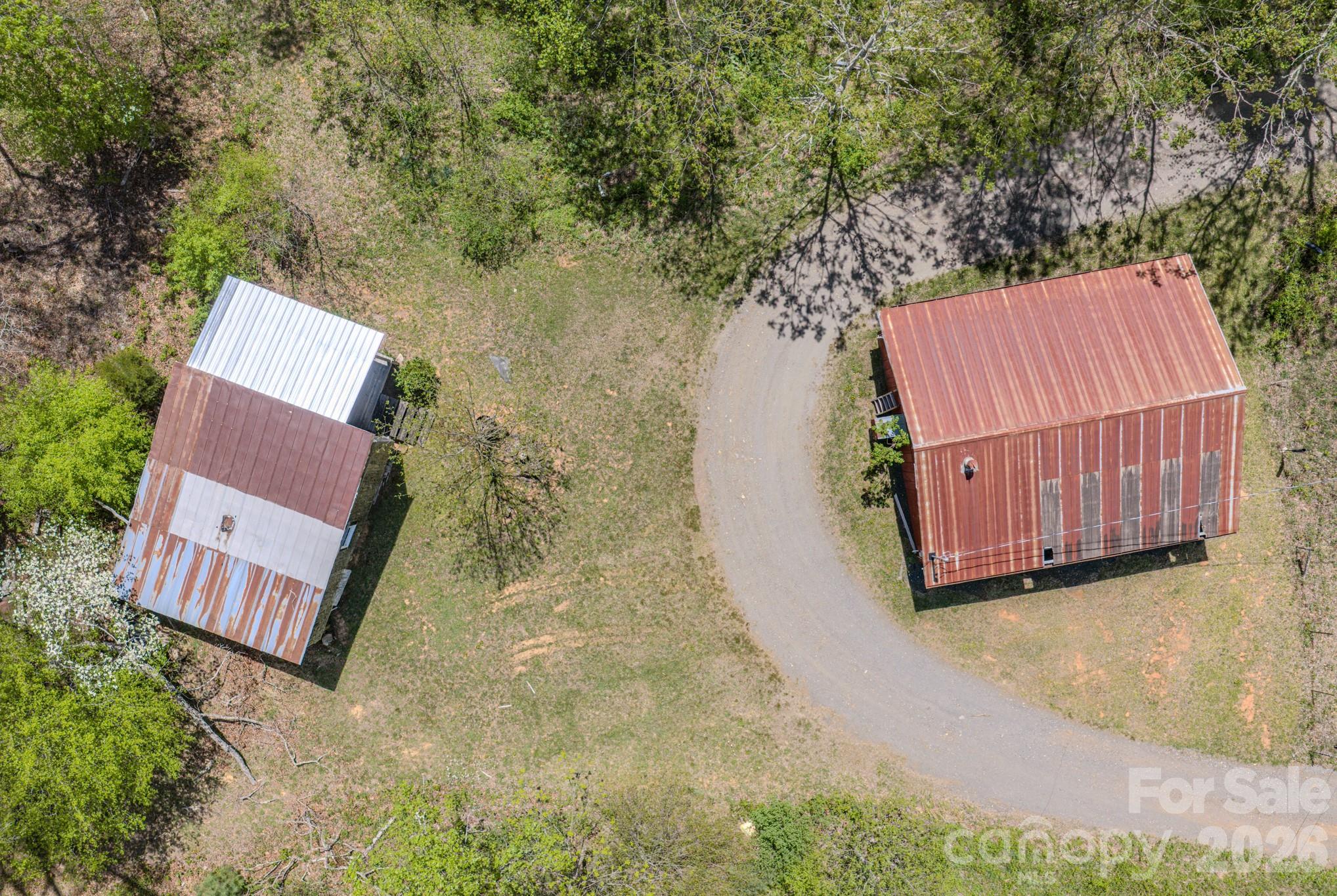 143 Gouge Cemetery Road Bakersville, NC 28705 - Photo 5 of 47 an aerial view of a house with backyard and trees