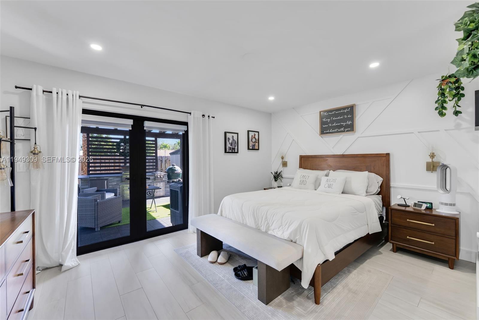 15101 Southwest 144th Court Miami, FL 33196 - Photo 12 of 32 a spacious bedroom with a bed and cabinets