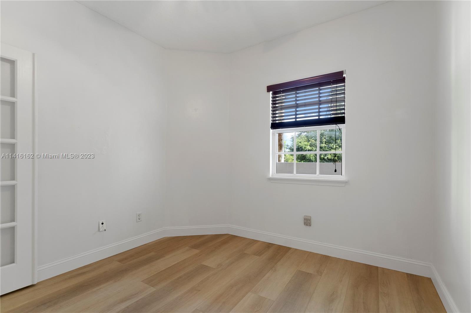22701 Camino Del Mar, Unit 25 Boca Raton, FL 33433 - Photo 12 of 19 an empty room with a window