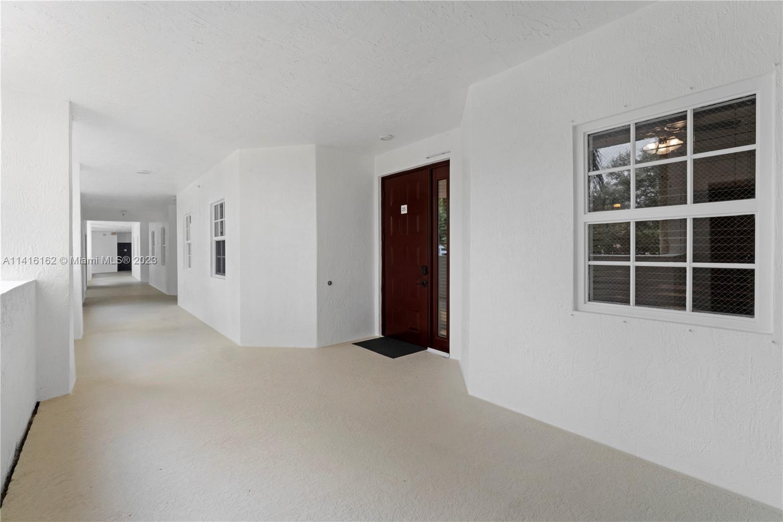 22701 Camino Del Mar, Unit 25 Boca Raton, FL 33433 - Photo 2 of 19 a view of empty room with windows