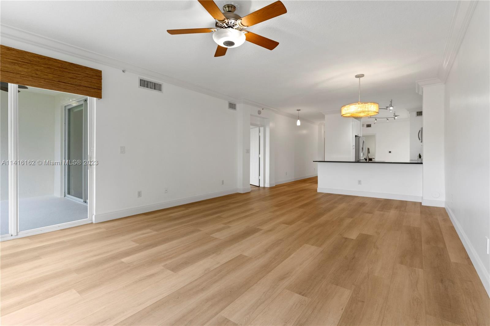 22701 Camino Del Mar, Unit 25 Boca Raton, FL 33433 - Photo 10 of 19 a view of a kitchen with a sink and a cabinet