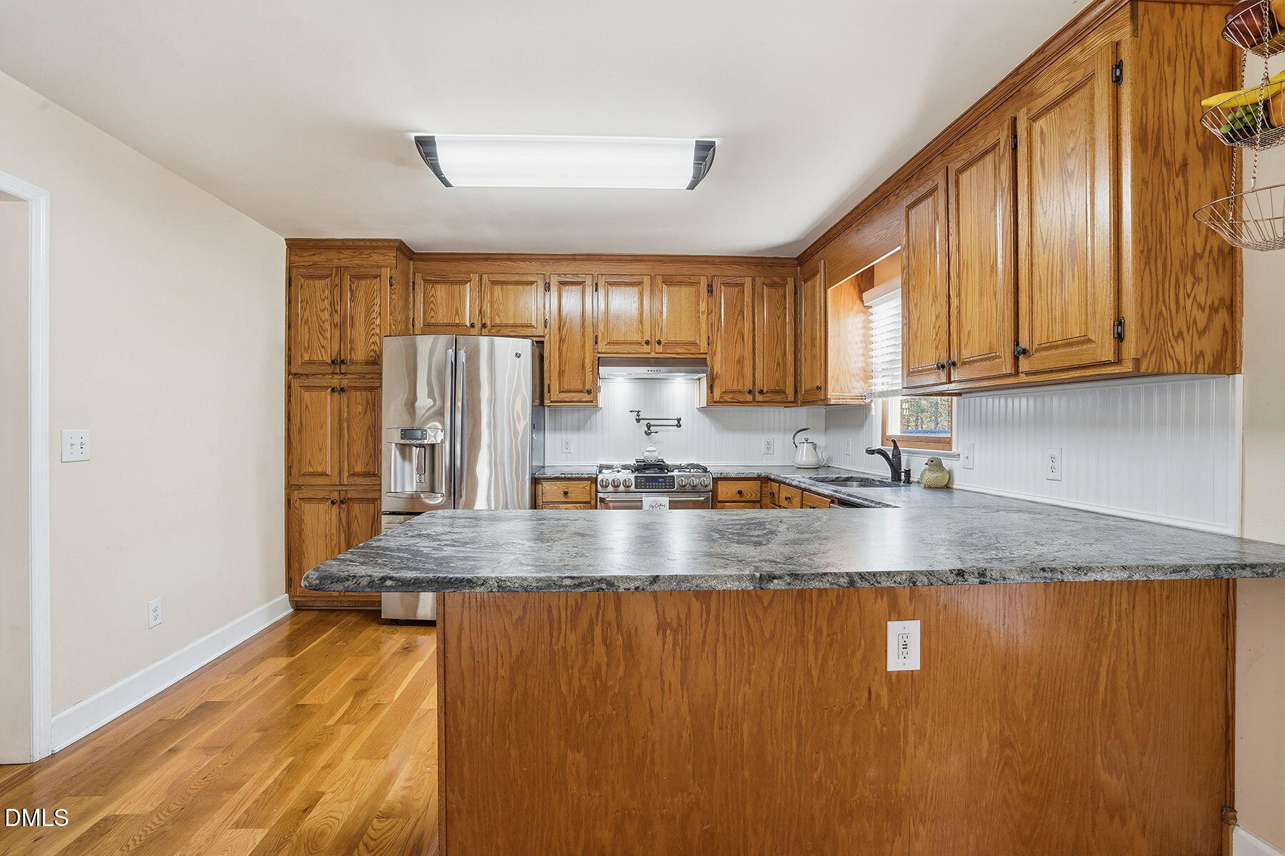 229 Plantation Road Clayton, NC 27520 - Photo 11 of 32 a view of a kitchen with granite countertop window
