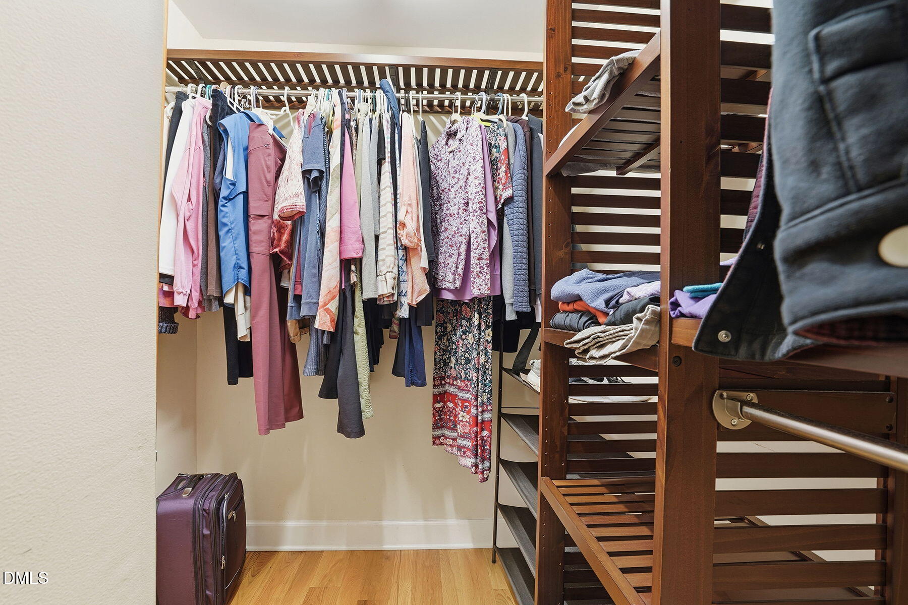 229 Plantation Road Clayton, NC 27520 - Photo 18 of 32 a view of walk in closet with clothes and shoes