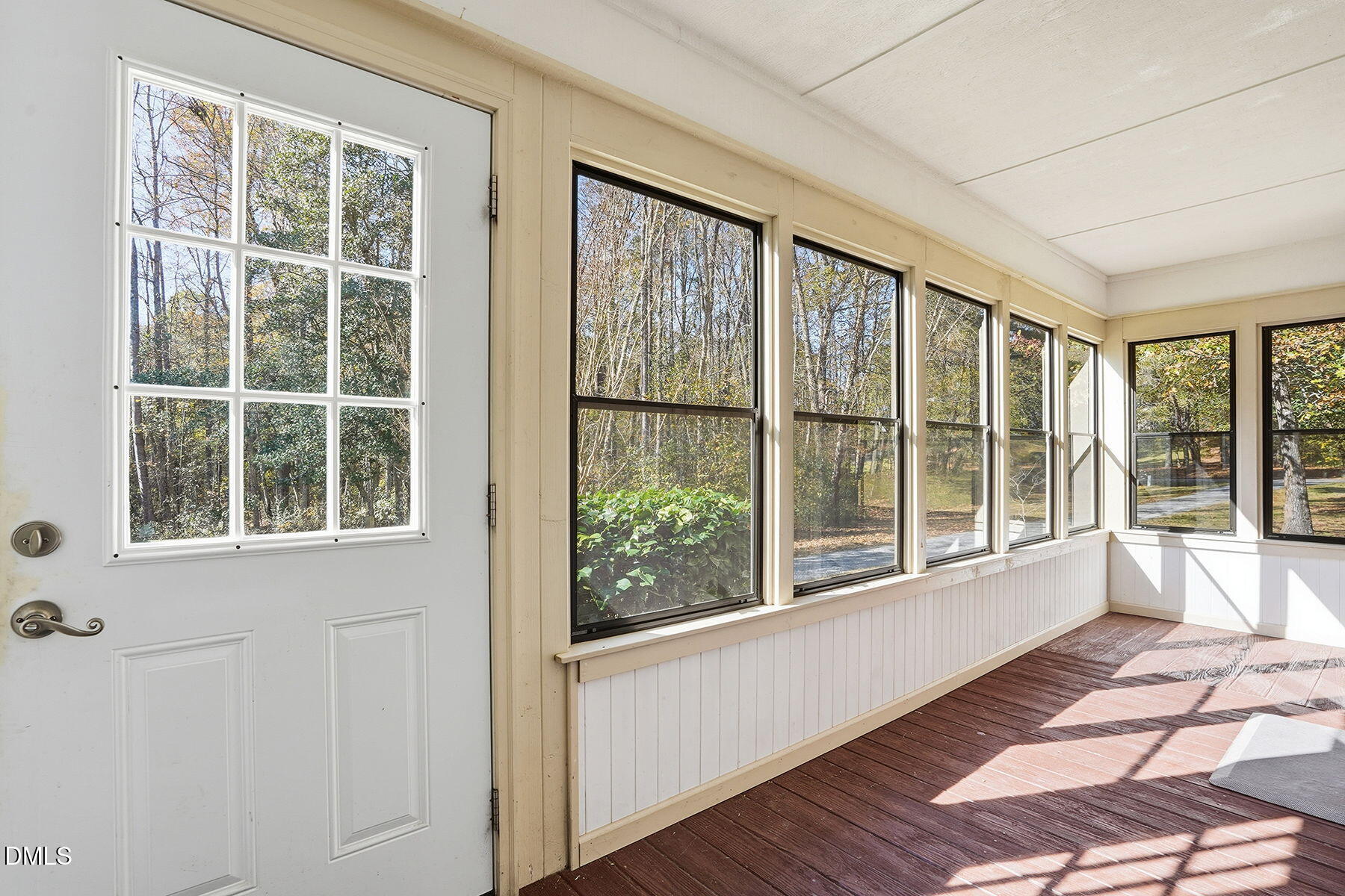 229 Plantation Road Clayton, NC 27520 - Photo 22 of 32 a view of a porch with wooden floor and front door