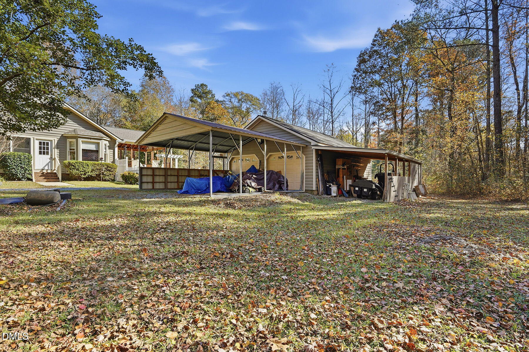 229 Plantation Road Clayton, NC 27520 - Photo 24 of 32 a view of a big house with a big yard and large trees