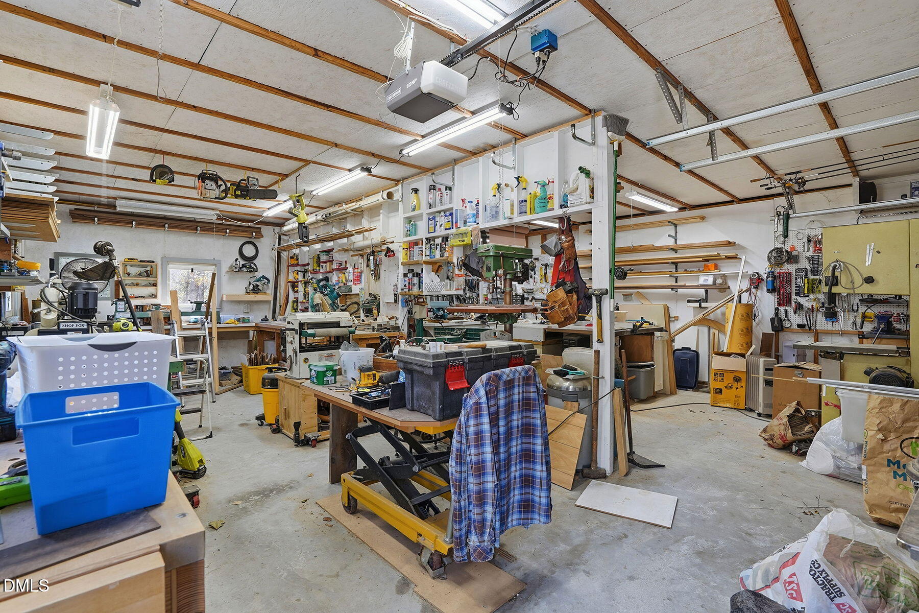 229 Plantation Road Clayton, NC 27520 - Photo 25 of 32 a view of a storage room with a lot of stuff