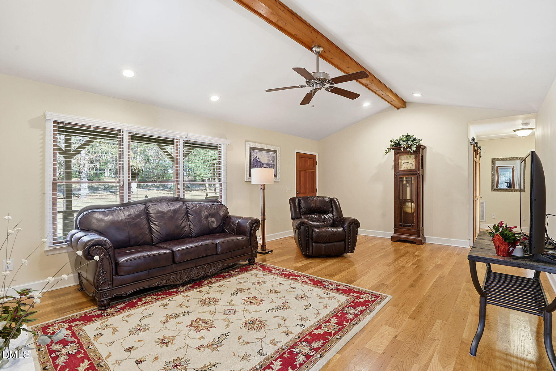 229 Plantation Road Clayton, NC 27520 - Photo 5 of 32 a living room with furniture and a rug