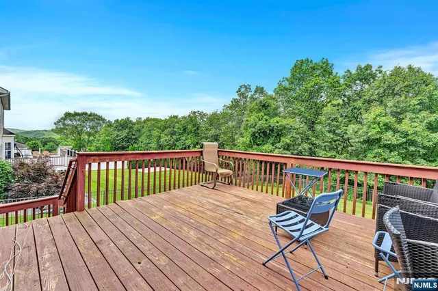 a view of a wooden deck with furniture