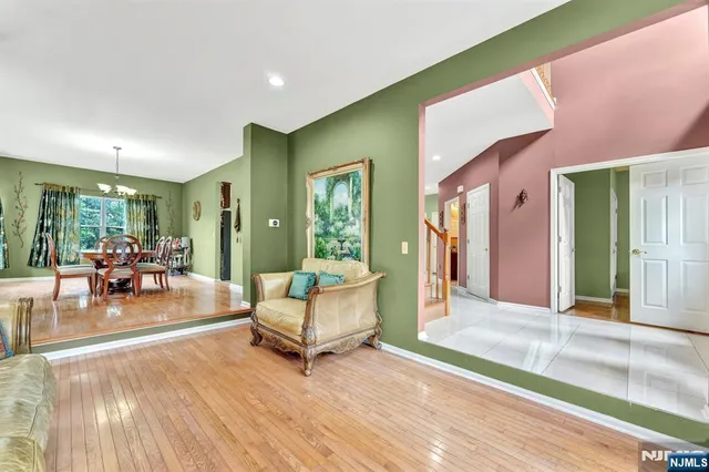 a living room with fireplace furniture and a wooden floor