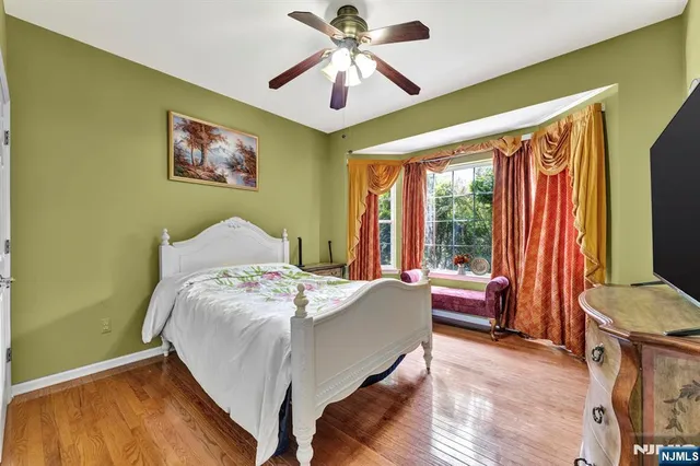 a bed room with a bed and a chandelier