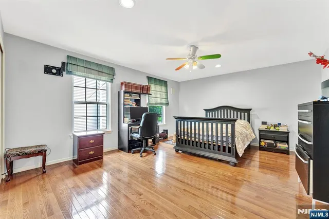 a bedroom with furniture and a window