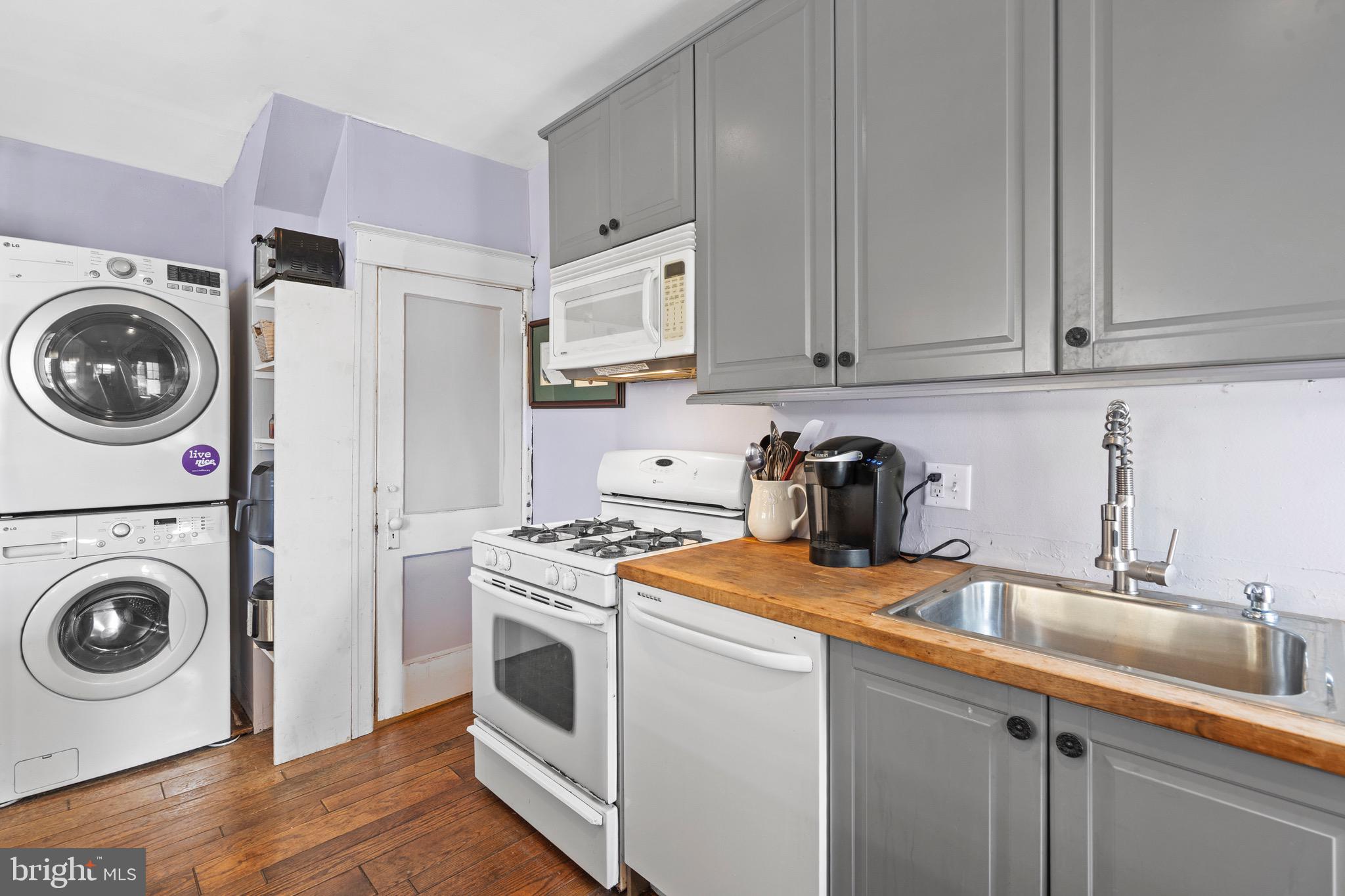 122 Wilson Avenue Havertown, PA 19083 - Photo 15 of 30 a view of a kitchen with sink stove and washer