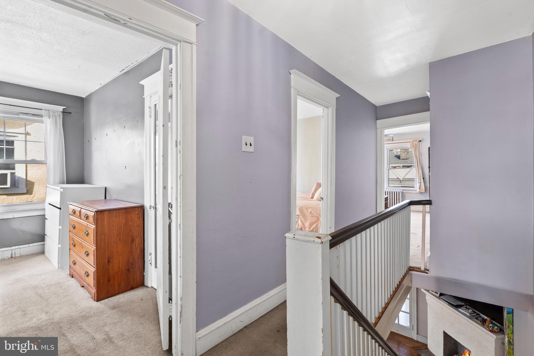 122 Wilson Avenue Havertown, PA 19083 - Photo 16 of 30 a view of a hallway with a dining table & cabinets