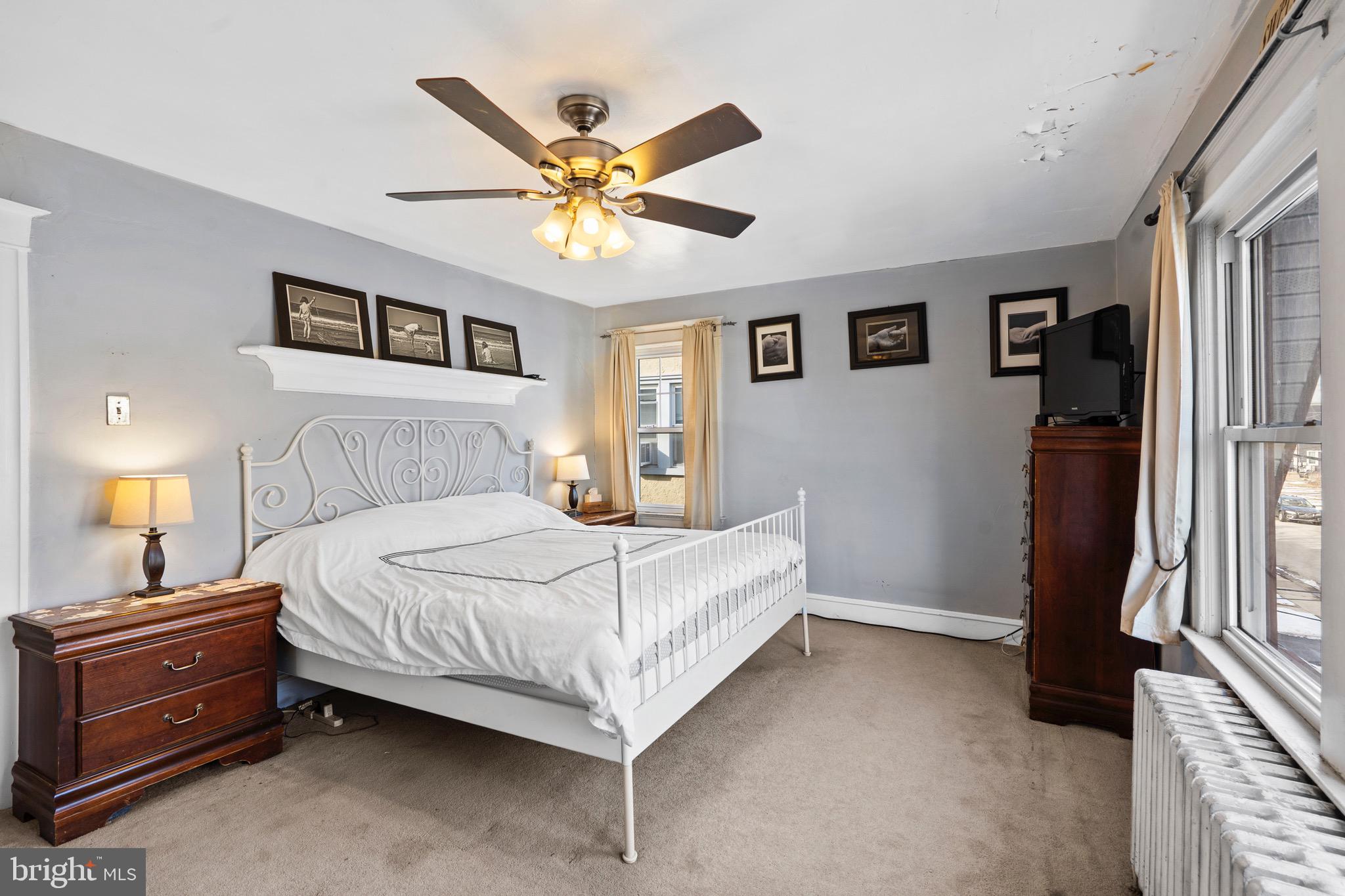 122 Wilson Avenue Havertown, PA 19083 - Photo 18 of 30 a bedroom with a bed and a chandelier