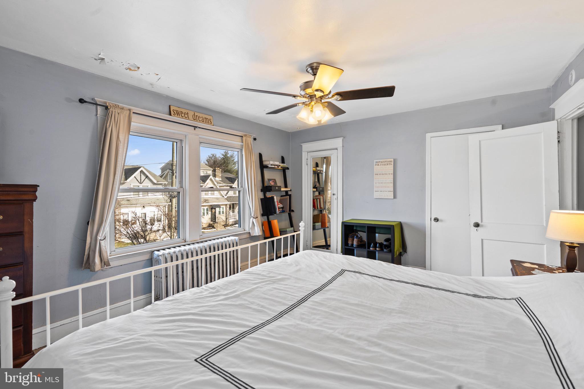 122 Wilson Avenue Havertown, PA 19083 - Photo 19 of 30 a bedroom with a bed and a large window