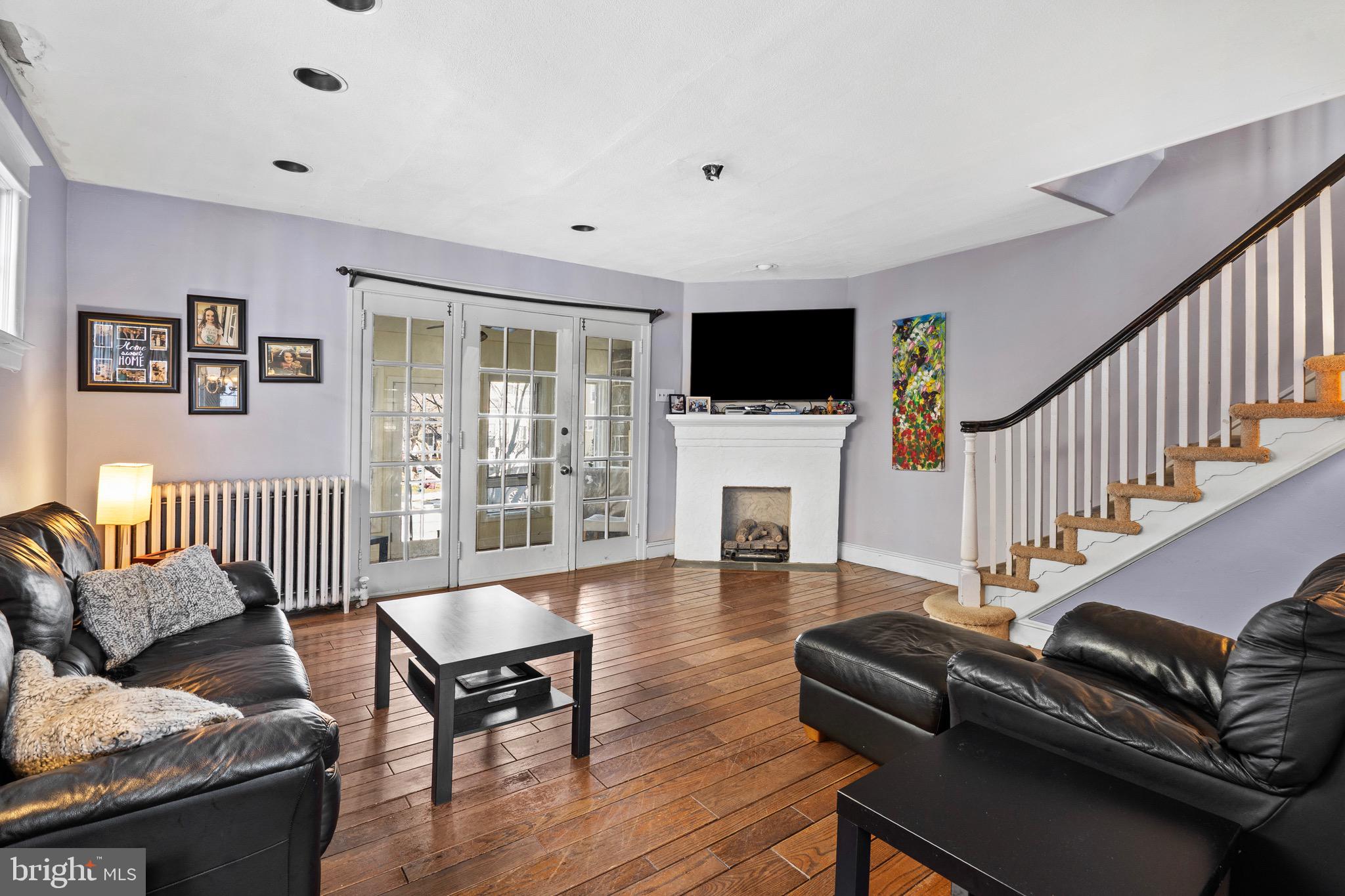122 Wilson Avenue Havertown, PA 19083 - Photo 7 of 30 a living room with furniture fireplace and a flat screen tv